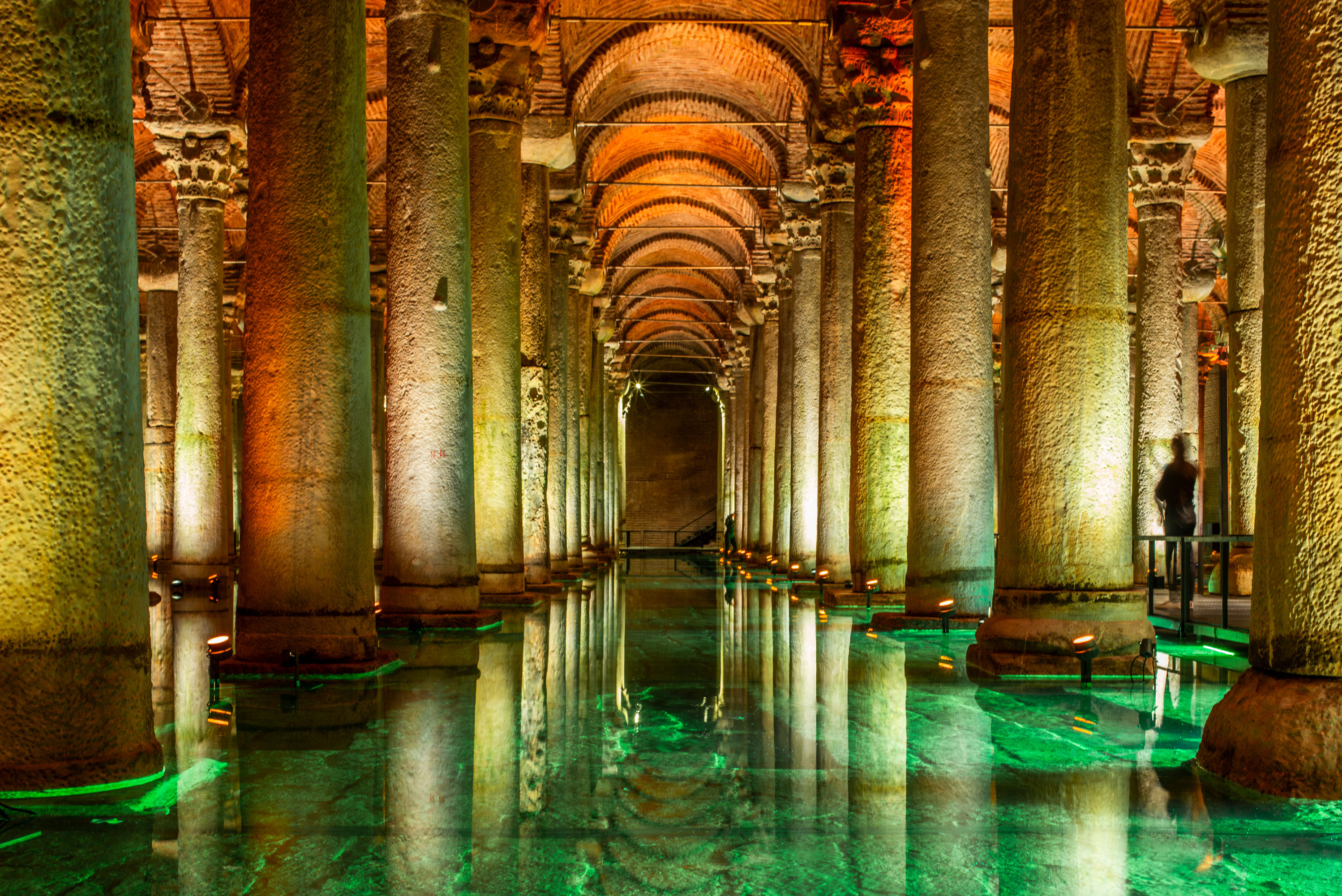 People silhouette and reflections among the columns of the Cistern Basilica